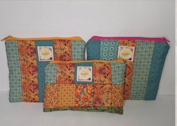 Three patchwork zipper pouches in teal and orange